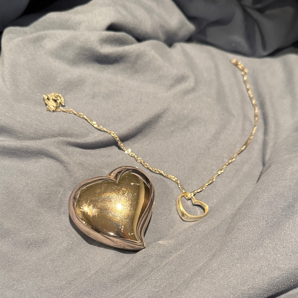 Silver heart necklace with heart shaped jewelry holder